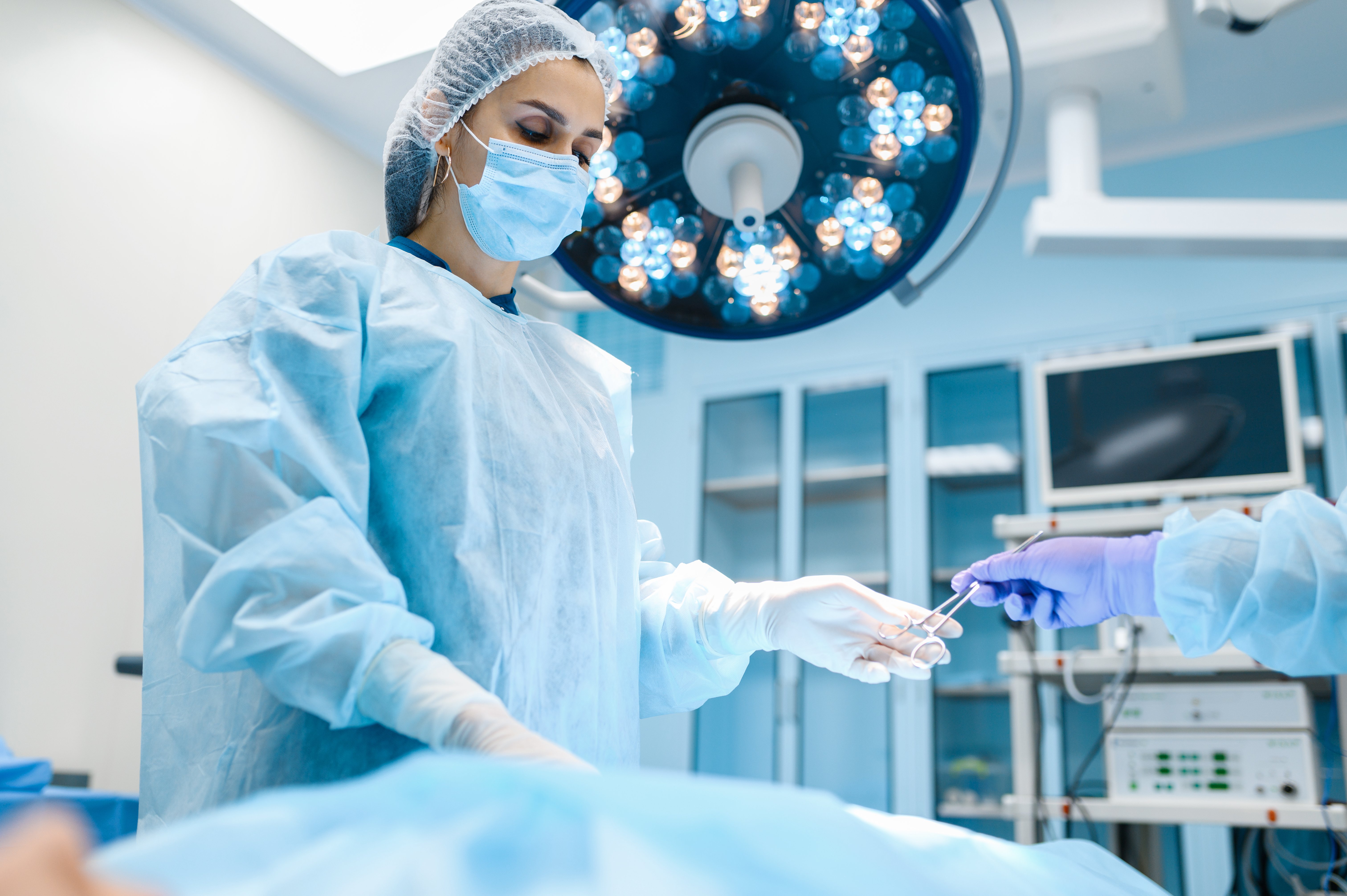 female-surgeon-in-gown-and-mask-in-operating-room-2024-12-05-18-18-22-utc